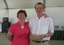 Immediate Past President Gail congratulates Rotarian of the Year Ray Spencer.